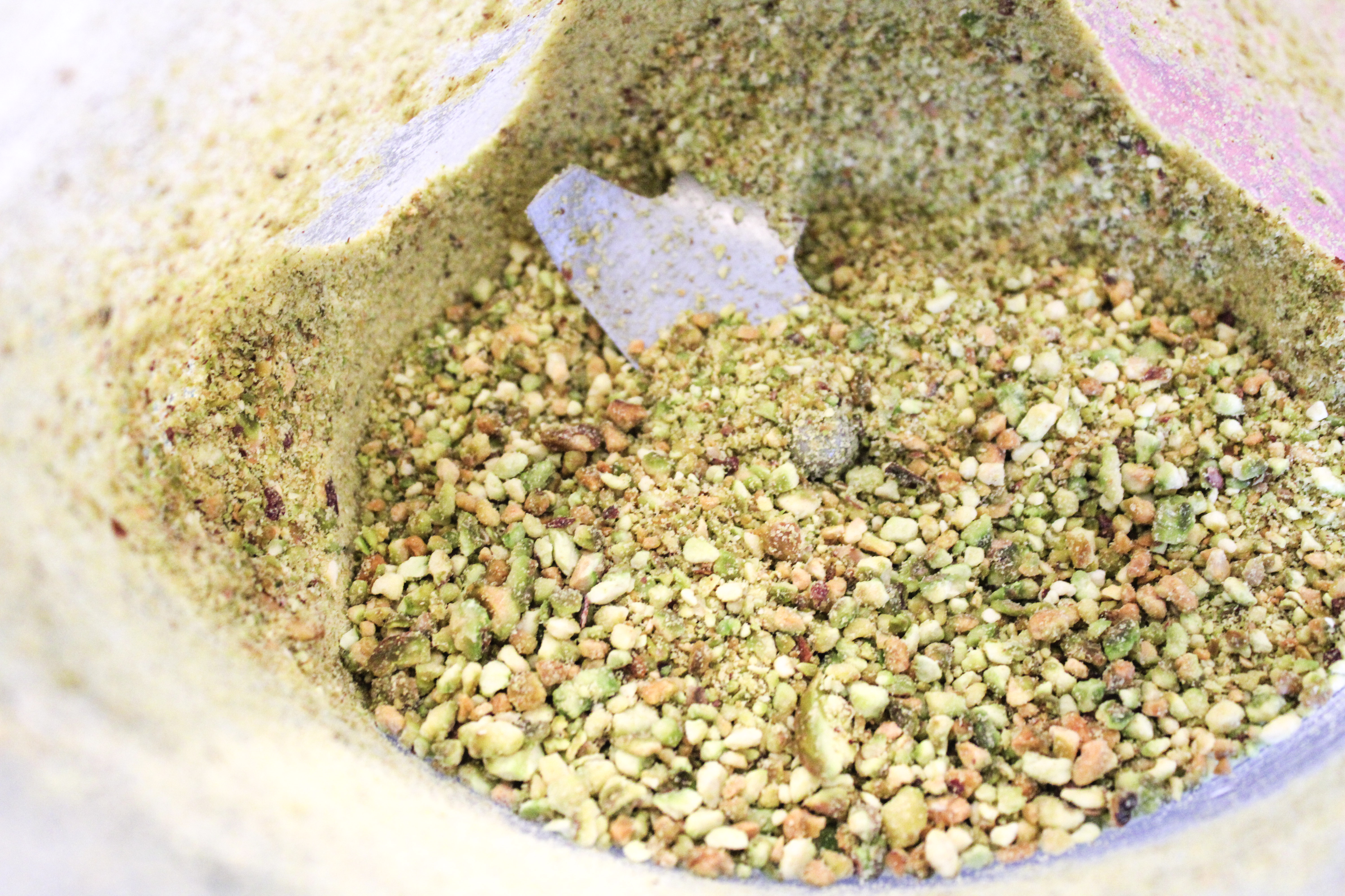 Arial shot of ground pistachio crumbles in a blender