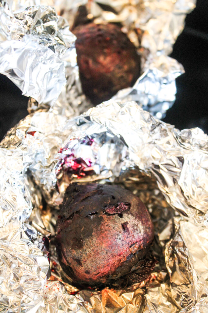 Roasted beets surrounded in their wrinkly foils.