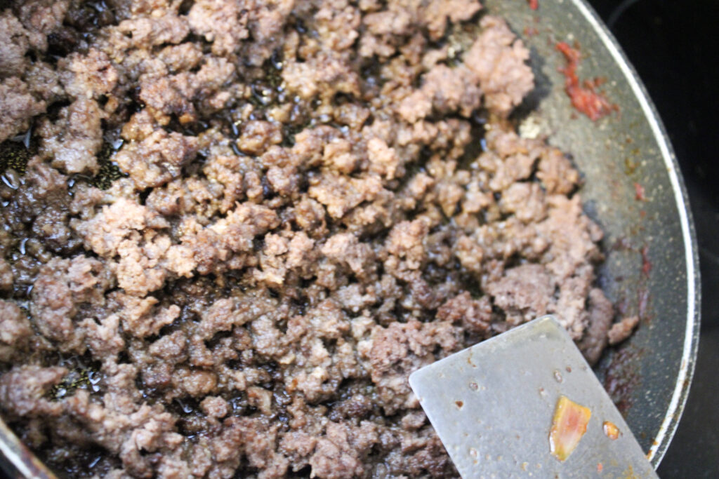 Ground beef cooking in a pan