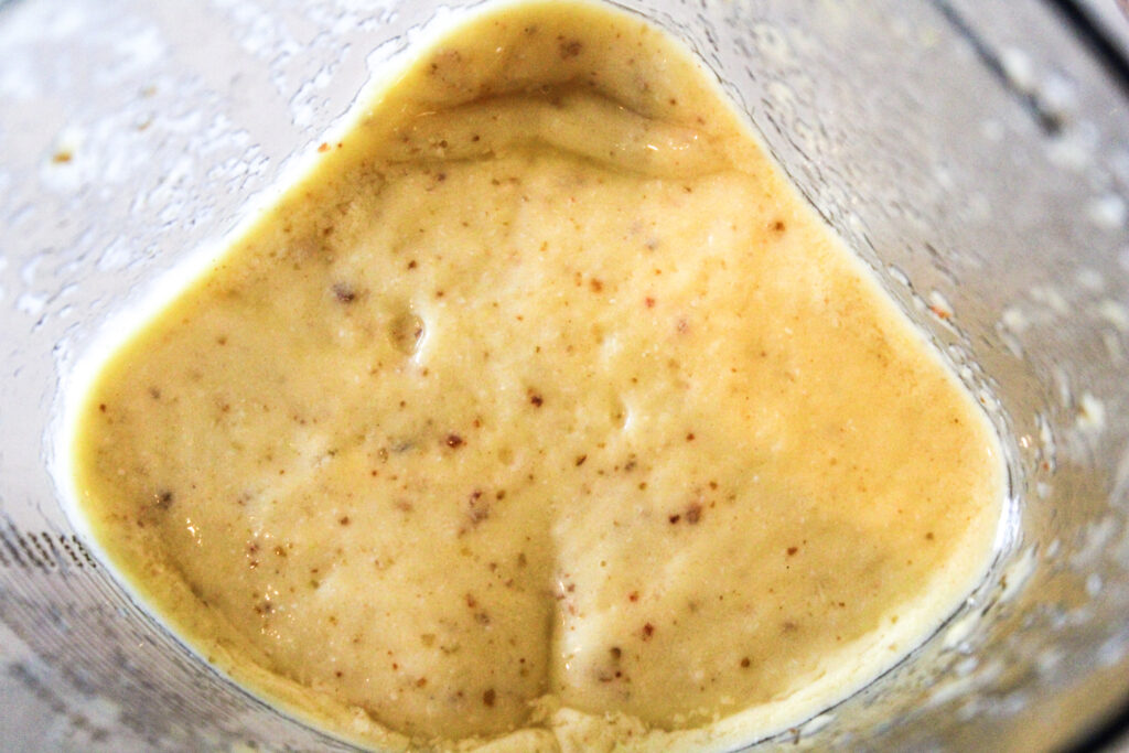 A passionfruit coconut smoothie in the blender.