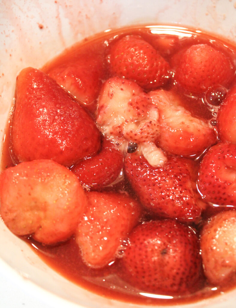 Microwaved strawberries in a bowl.