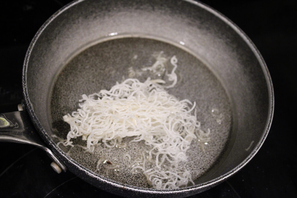Fried vermicelli noodles in a pan.