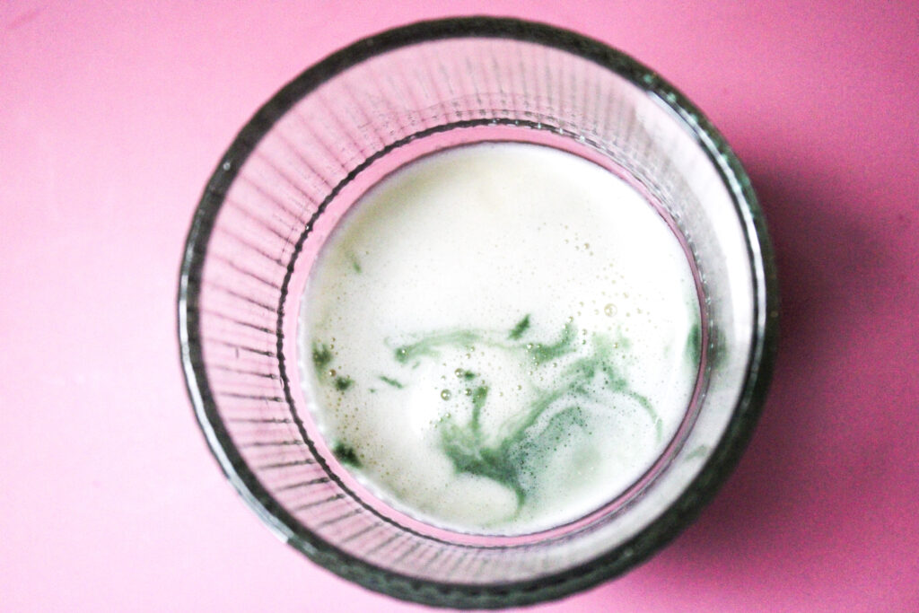 Chlorophyll swirls in milk.